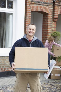 Furniture removal team preparing items in Docklands apartment building