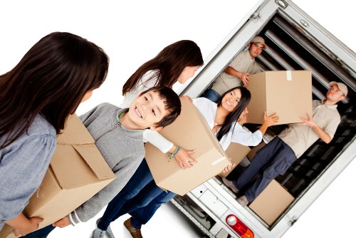 Removal van supporting same day moves in Docklands near modern apartments