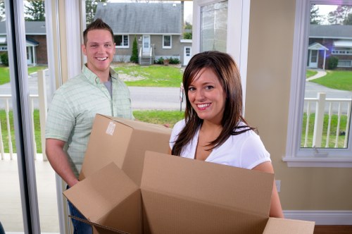 Packed household boxes and furniture ready for house removals in Docklands