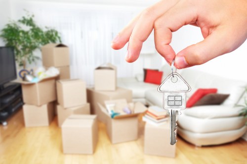 Professional movers handling furniture during a same day relocation in Docklands