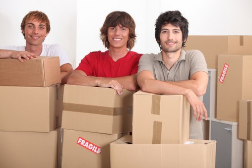 Careful loading of office furniture for a Docklands business move