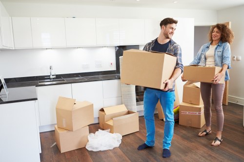 Specialist movers using protective equipment for a piano move in Docklands