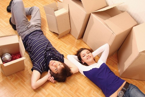 Movers transporting office equipment through a Docklands commercial property